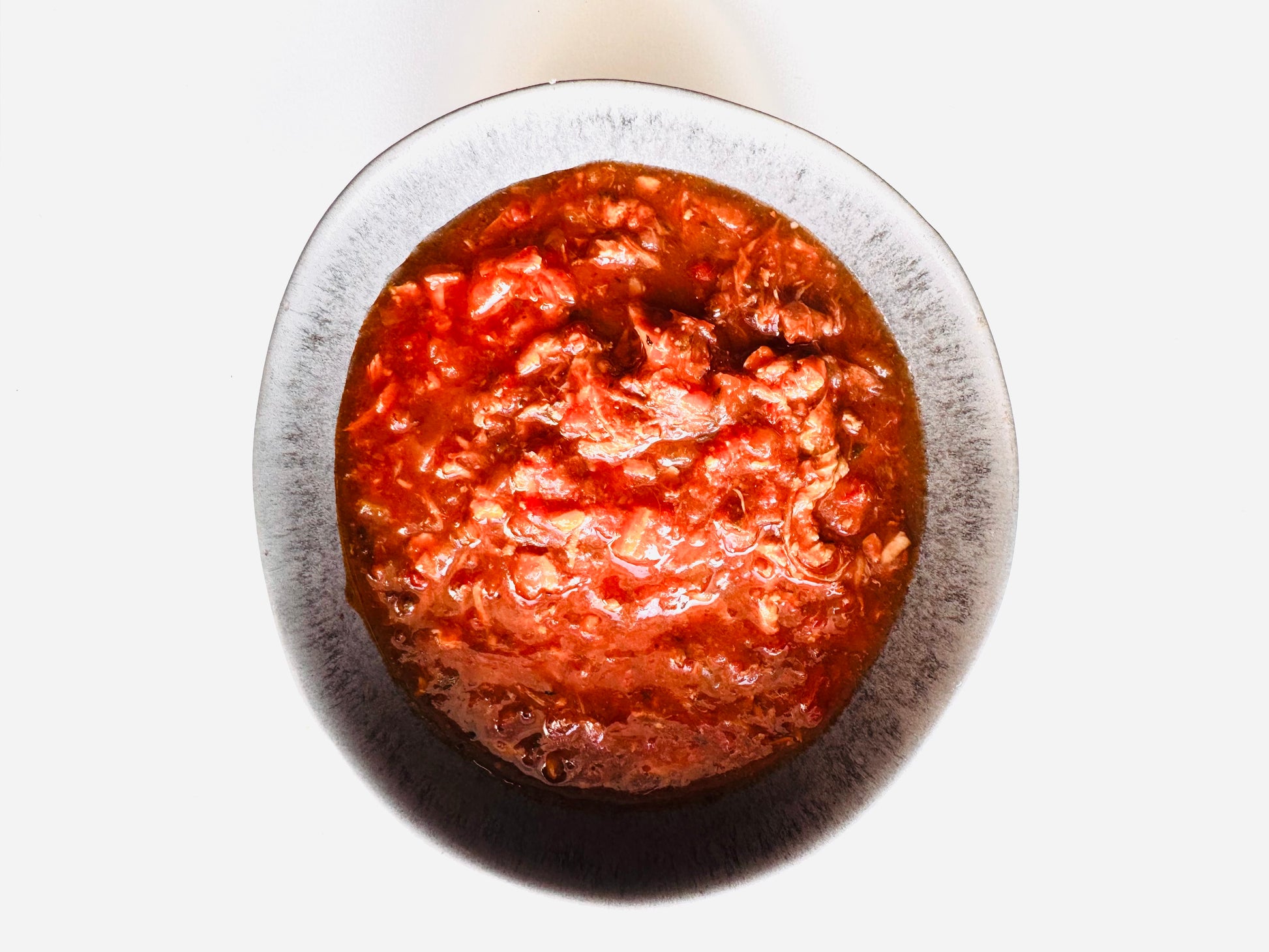 Flayvr Gourmet Cooking Kit featuring a rich and flavorful sauce in a bowl